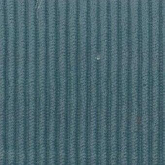 Ribbed fabric texture in teal-blue, displaying vertical parallel ridges and woven fibers; labeled “Moroso Floki Denim – Q” watermark.